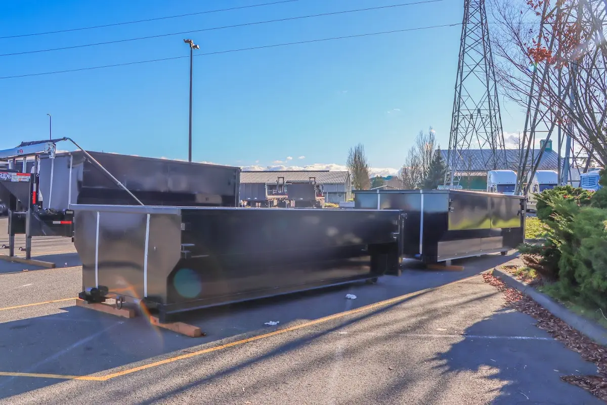 Roll-off dumpster ready for waste disposal at job site for Concrete Dumpster Rental in Kendallville